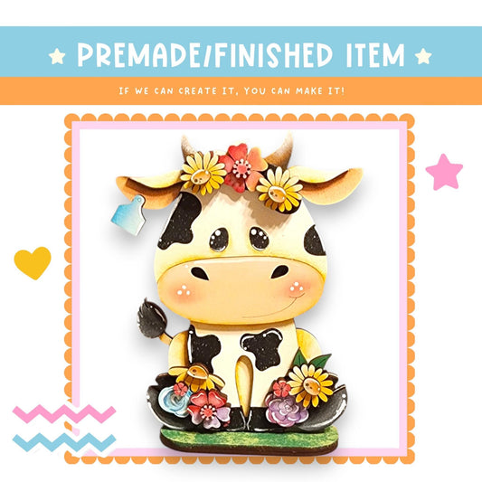 a picture of a cow with flowers on its head
