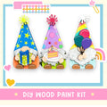 a group of three gnomes sitting on top of a table