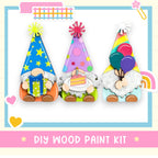 a group of three gnomes sitting on top of a table