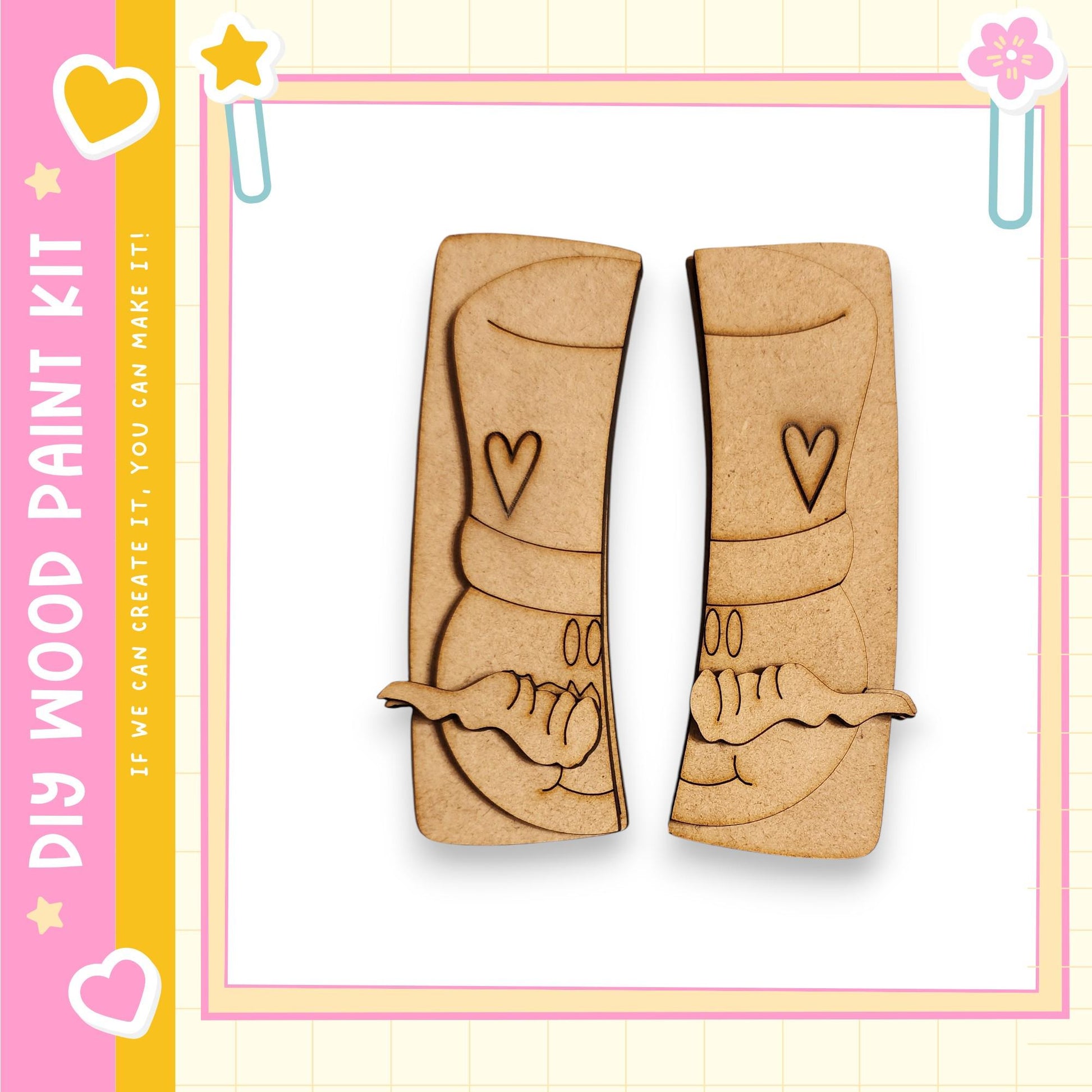 two wooden cutouts of a smiling face, each with a heart and a star, set against a pink and yellow background.