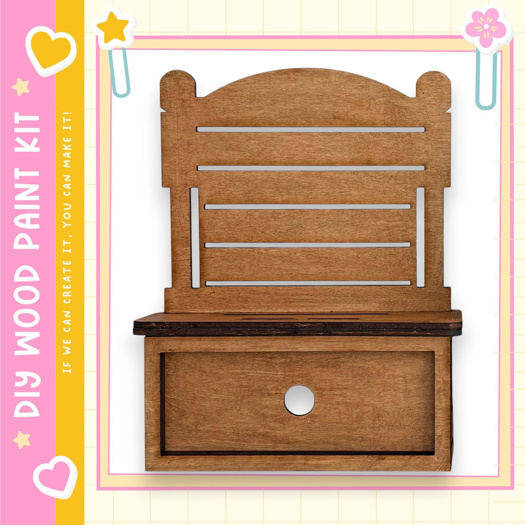 a wooden shelf with a drawer, set against a pink and yellow background with decorative elements.