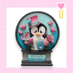 a snow globe with a penguin inside of it