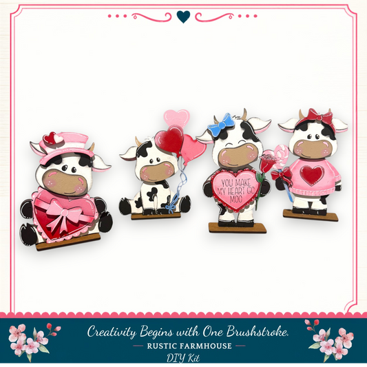 four cow-themed decorations, including a cow holding a heart, a cow holding a balloon, a cow holding a rose, and a cow holding a heart.