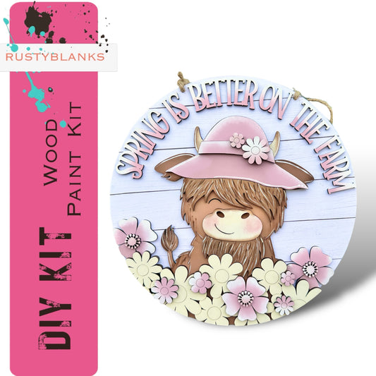 a badge with a picture of a bear wearing a pink hat