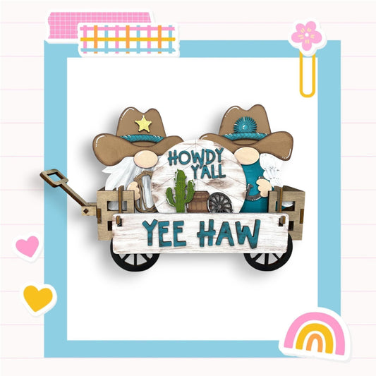 a paper cutout of two cowboys riding in a wagon