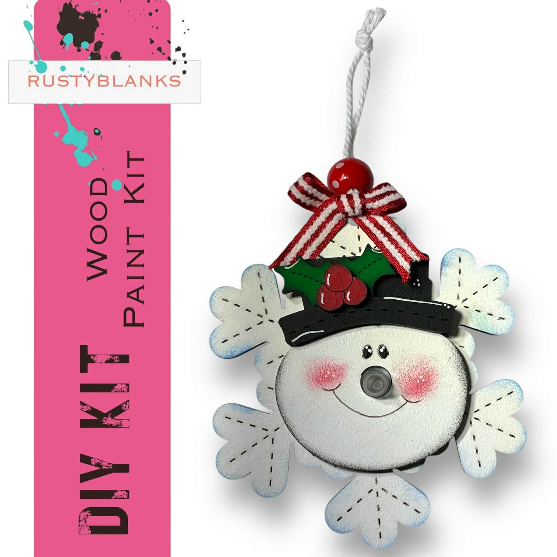 a snowman ornament hanging from a pink ribbon