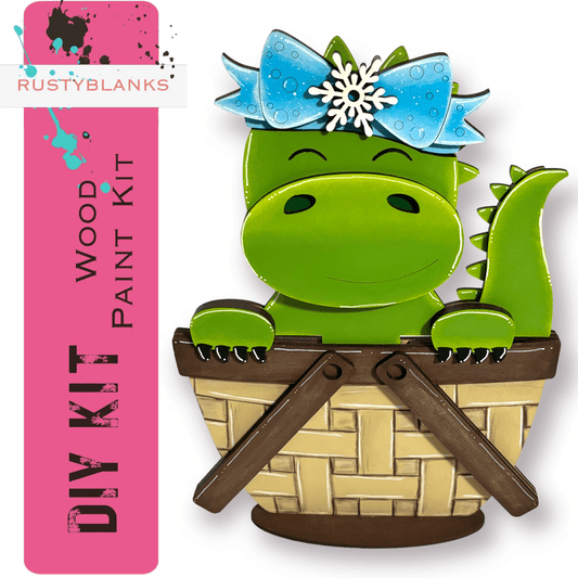 a picture of a green dinosaur in a basket
