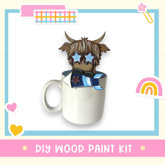 A mug with a cartoon character wearing sunglasses and a bow tie, surrounded by various colorful stickers and a rainbow-colored arc.