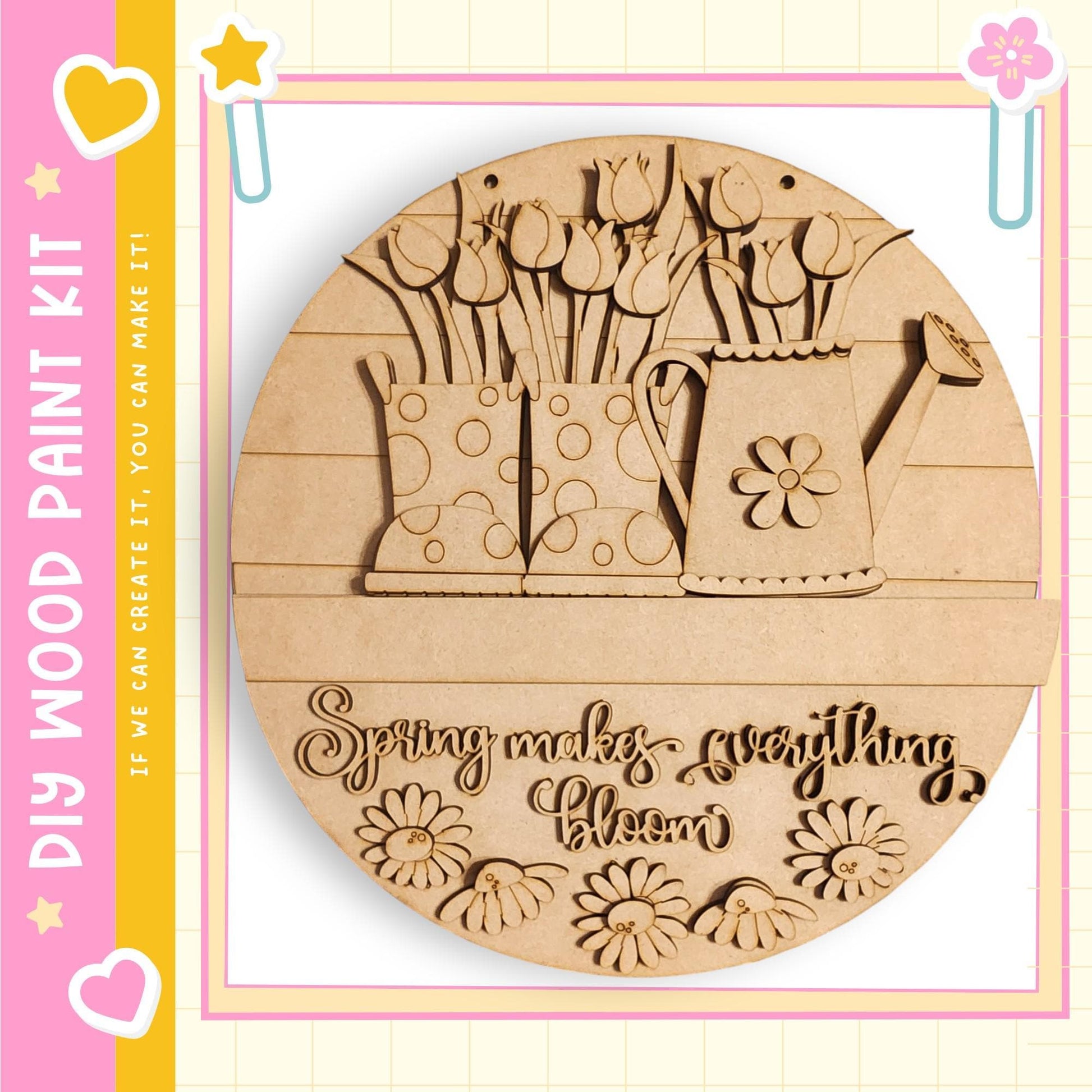 A wooden paint kit featuring a round wooden frame with a design of flowers and a watering can. The kit is labeled "My Wood Paint Kit" and "Spring makes everything bloom".