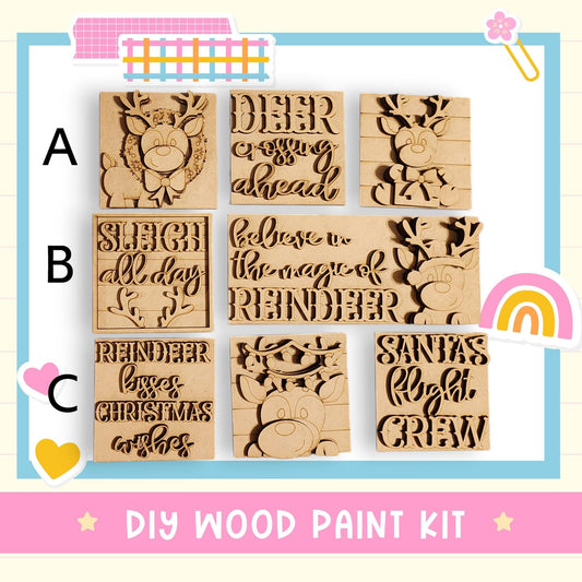 a DIY wood paint kit with various cutout shapes in the shape of reindeer and Christmas-themed words.