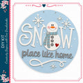 A snowman decoration with the text "SNOW place like home" and snowflakes surrounding it.