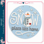 A snowman decoration with the text "SNOW place like home" and snowflakes surrounding it.