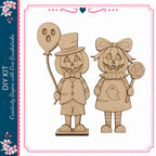 two wooden figures, a pumpkin and a ghost, holding a balloon and a lollipop, respectively.