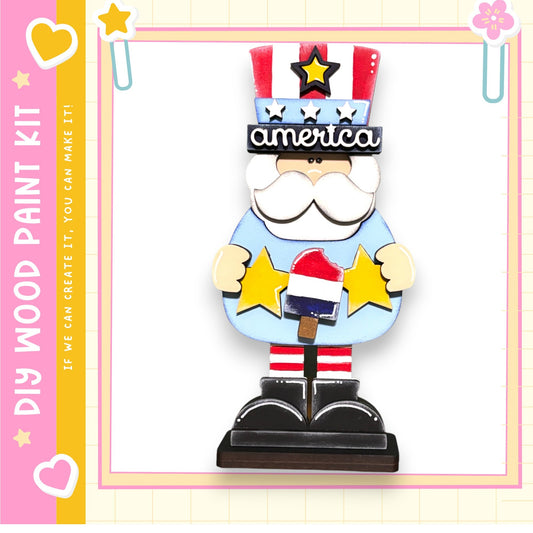 a wooden figure wearing a patriotic hat with stars and stripes, holding a popsicle.