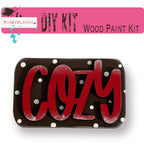 a wooden sign that says cozy on it