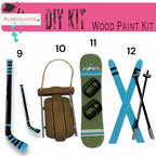 a snowboard, skis, snowboard, and ski poles are arranged in