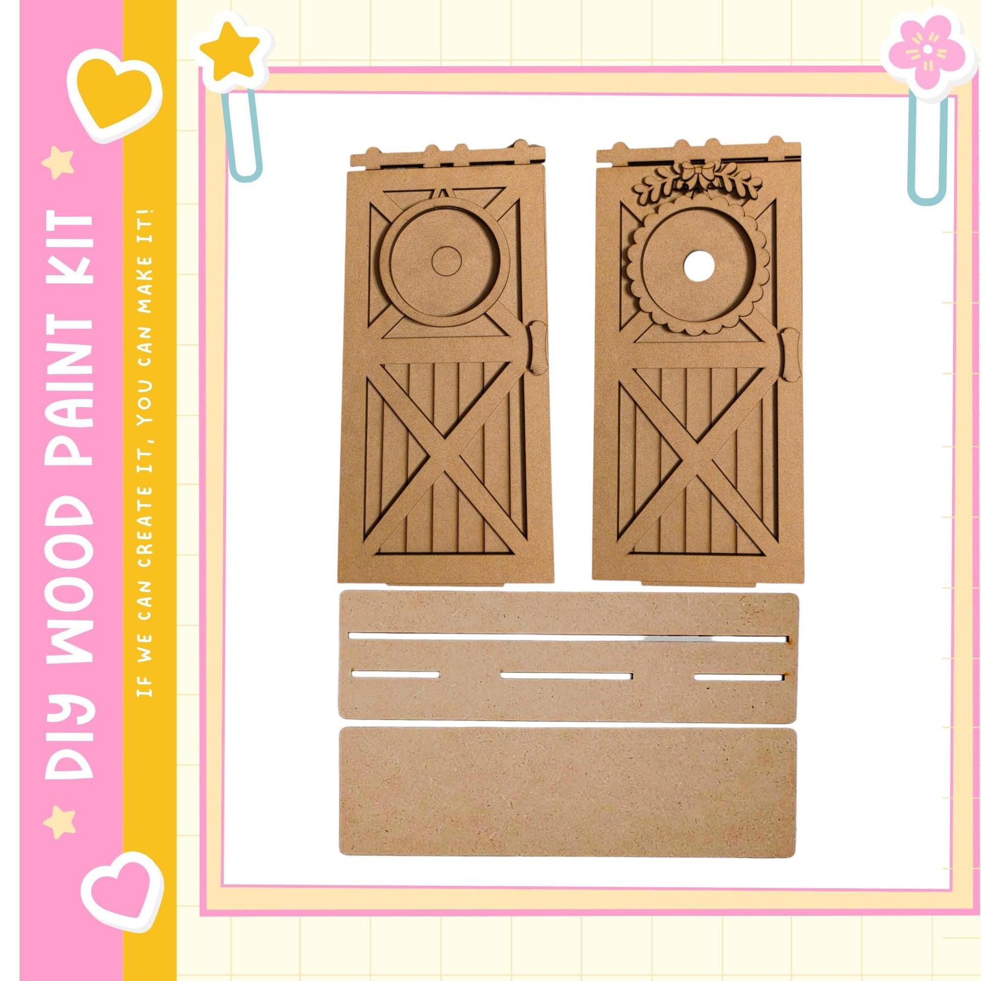 two wooden doors with decorative elements, such as a star and a wreath, attached to them. The doors appear to be made of cardboard and are part of a DIY wood paint kit.
