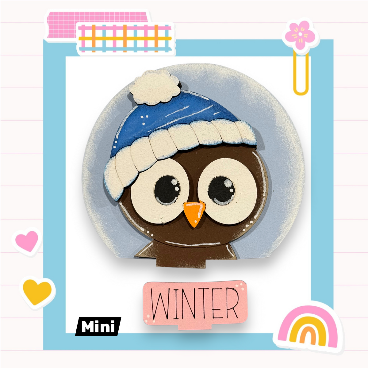 A cartoon image of an owl wearing a blue hat and the word "WINTER" written below it, surrounded by various colorful and decorative elements such as hearts, a rainbow, and a flower.