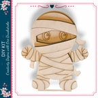 A wooden figure resembling a mummified character, with a bandage wrapped around its head and arms, is depicted in the image.