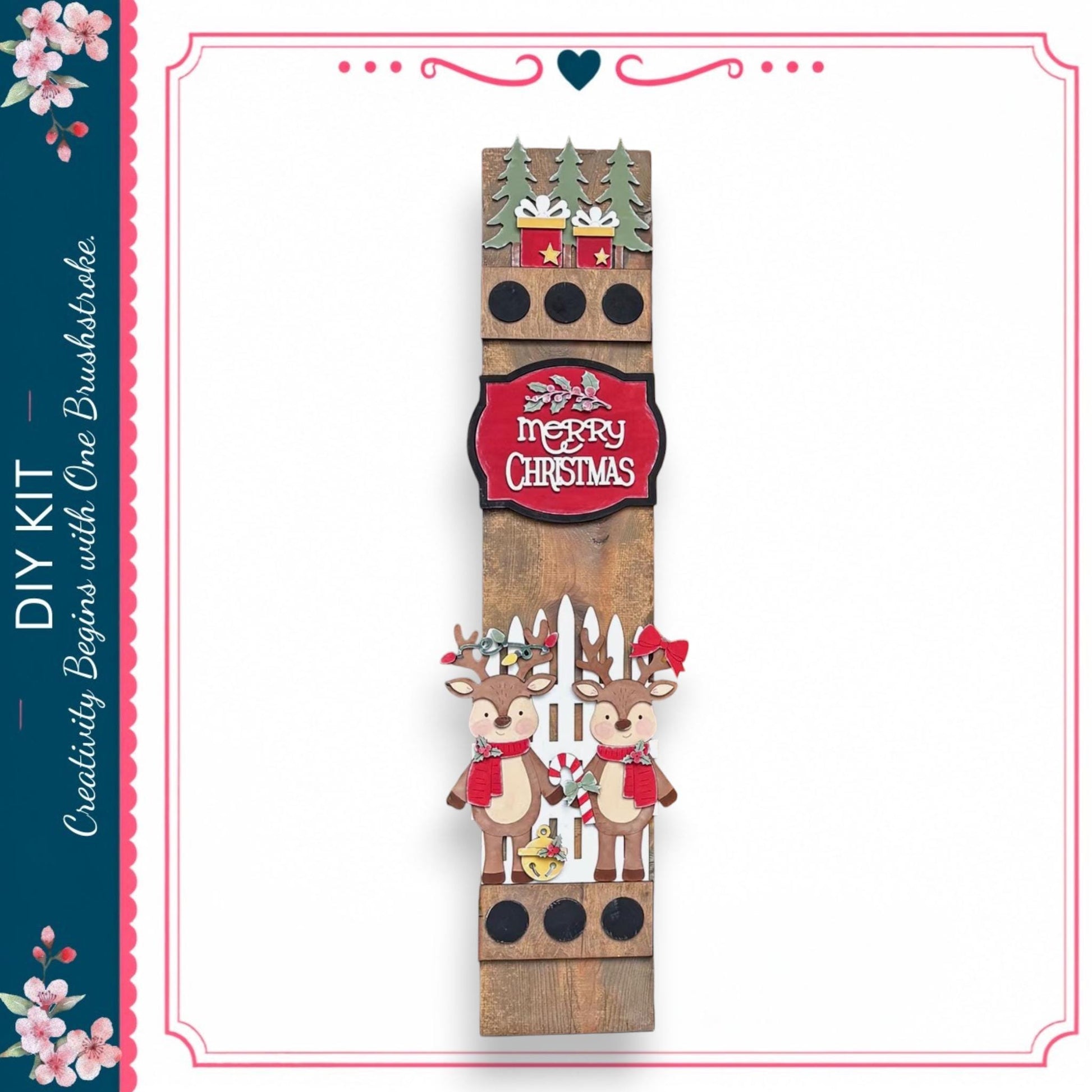 A wooden Christmas decoration with two reindeer and a "Merry Christmas" sign.