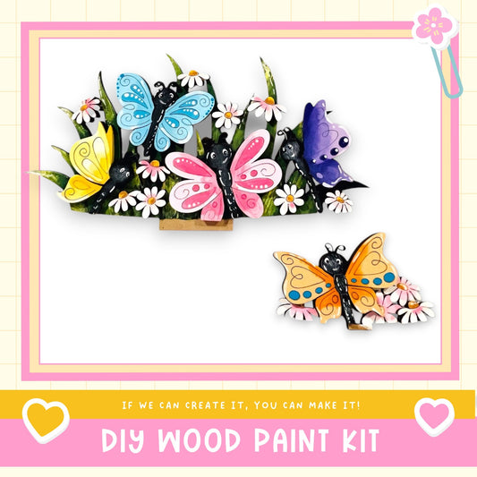 The image is a colorful and whimsical DIY wood paint kit featuring a variety of butterflies and flowers.