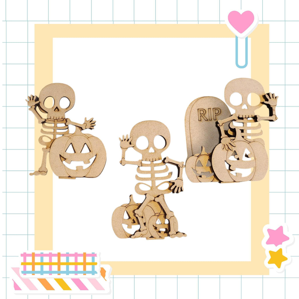 three wooden skeleton figures, each holding a carved pumpkin, arranged in a frame.
