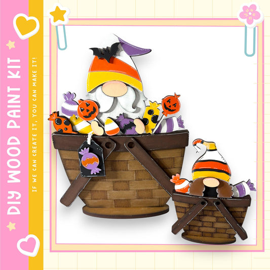 A Halloween-themed painting kit featuring a gnome and a basket filled with candy.