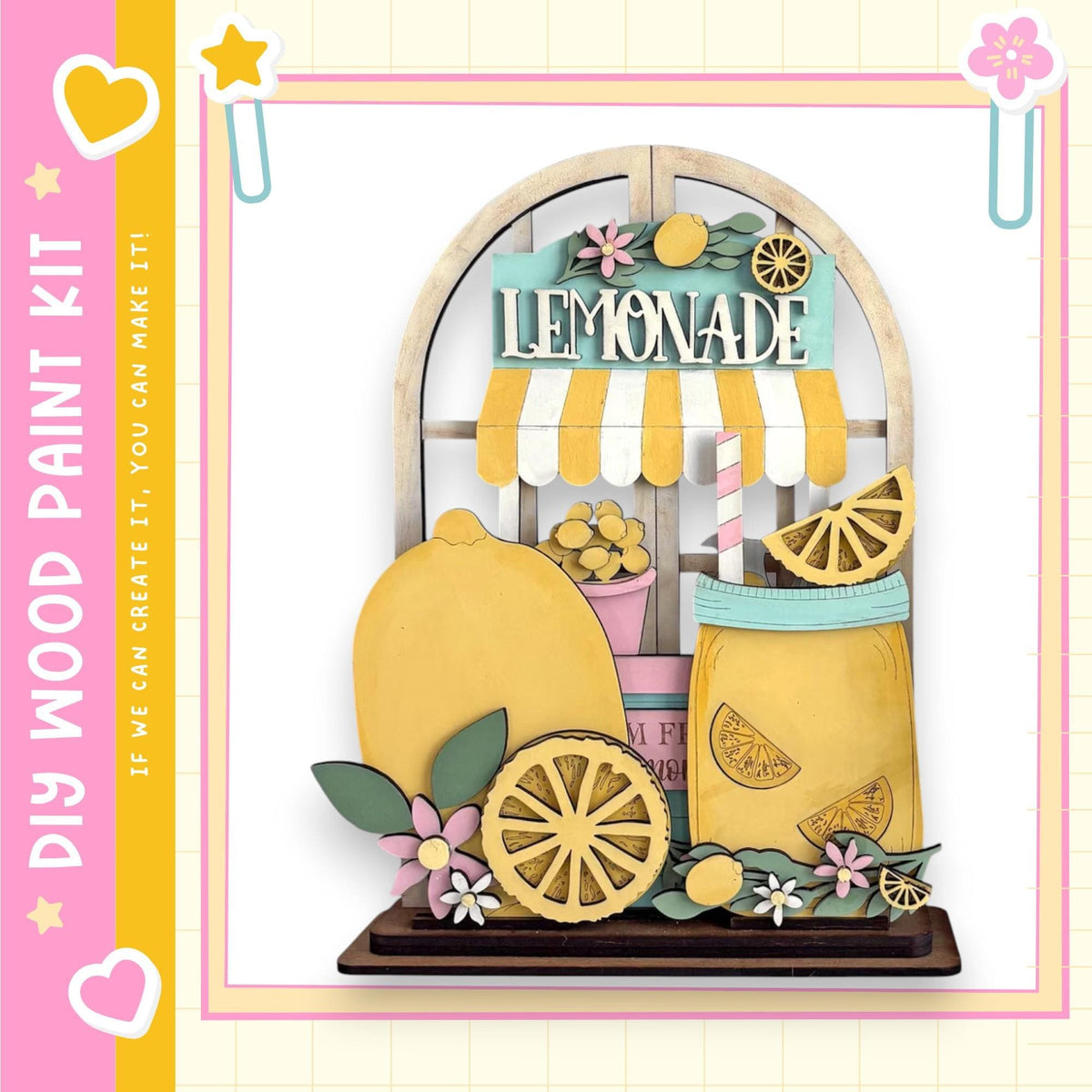 A colorful and whimsical lemonade stand made of wood, featuring a yellow lemonade sign, a glass pitcher, and various decorative elements such as flowers and leaves.