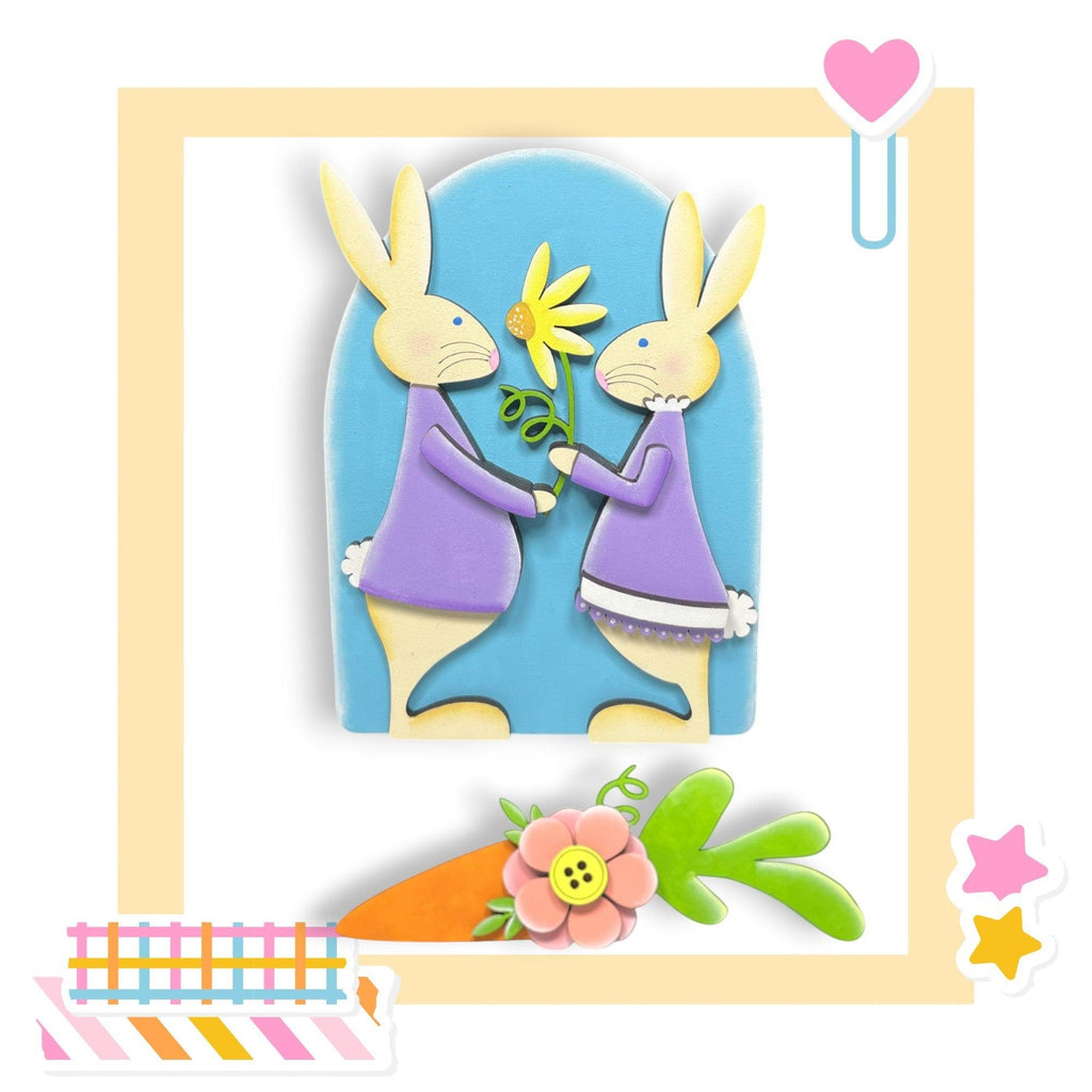 a picture of two rabbits holding a flower