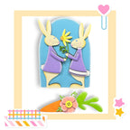 a picture of two rabbits holding a flower
