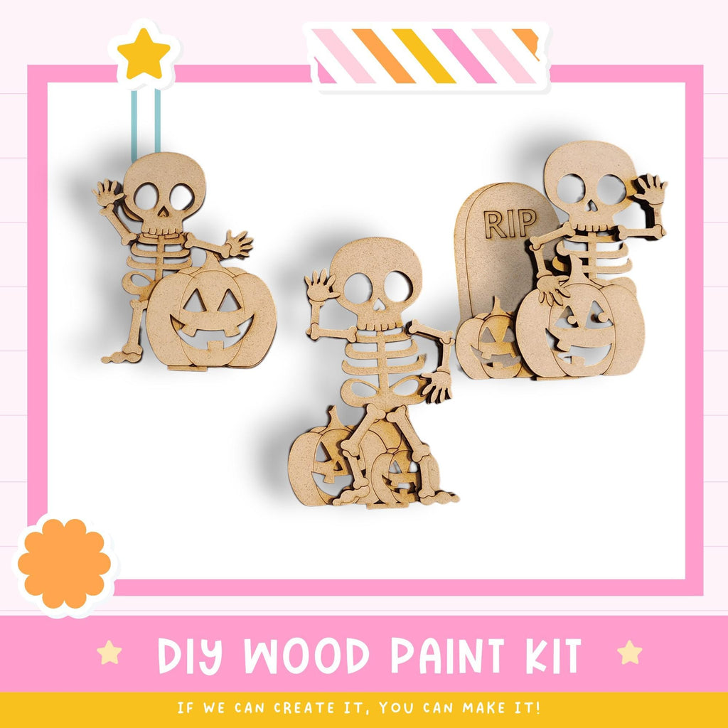 a DIY wood paint kit for creating Halloween-themed wooden figures, including skeletons and pumpkins.
