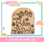 A wooden sign with the word "Believe" carved into it, surrounded by a decorative border and various colorful stickers.