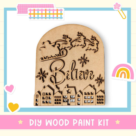 A wooden sign with the word "Believe" carved into it, surrounded by a decorative border and various colorful stickers.