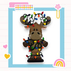 a paper cut out of a moose with christmas lights