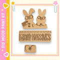 a kit for creating Easter-themed decorations, including a pair of wooden Easter bunny figures and a sign that says "Easter Blessings".