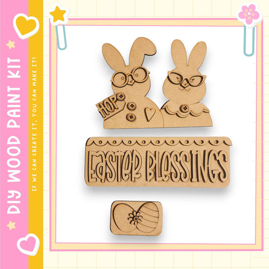 a kit for creating Easter-themed decorations, including a pair of wooden Easter bunny figures and a sign that says "Easter Blessings".