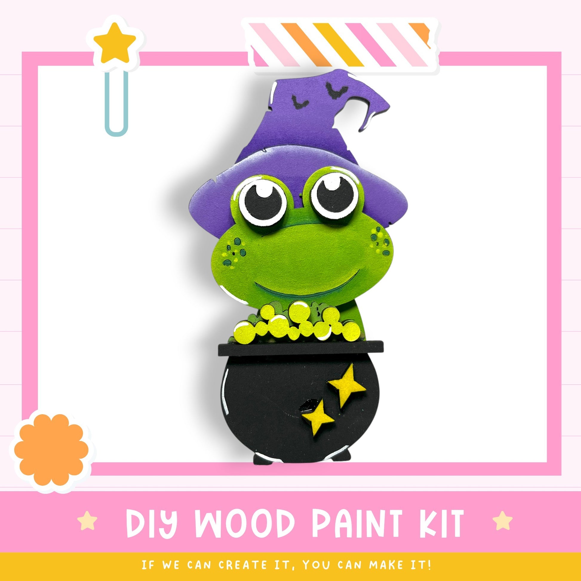 a DIY wood paint kit for creating a whimsical frog-shaped decoration, with a witch's hat and a cauldron.
