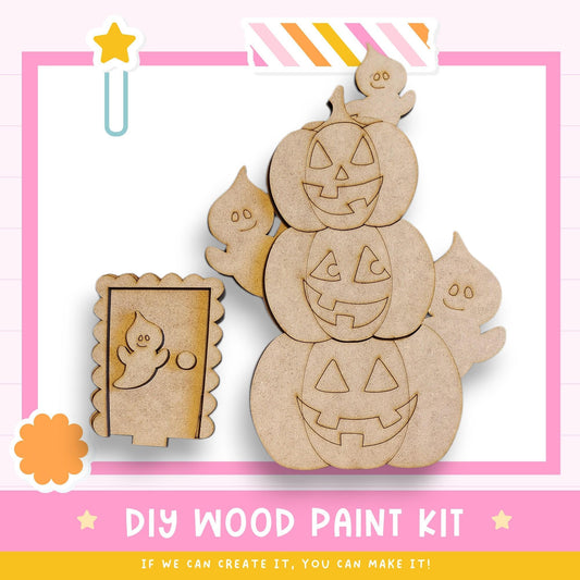 The image is a DIY wood paint kit featuring a Halloween-themed design, including carved pumpkins and a ghost.