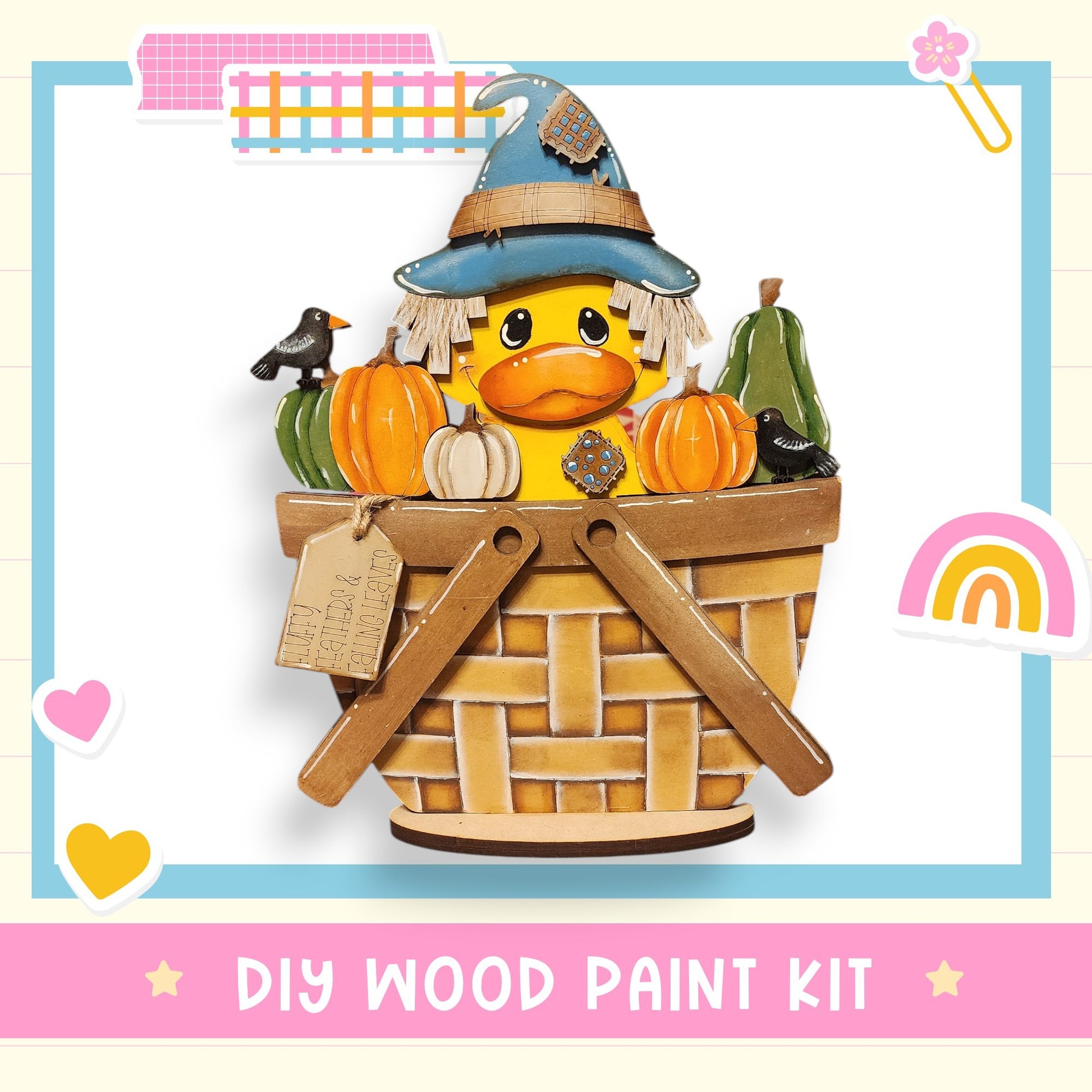 A whimsical illustration of a rubber duck wearing a witch's hat and surrounded by pumpkins and a bird, with the text "DIY WOOD PAINT KIT" and a rainbow-colored background.