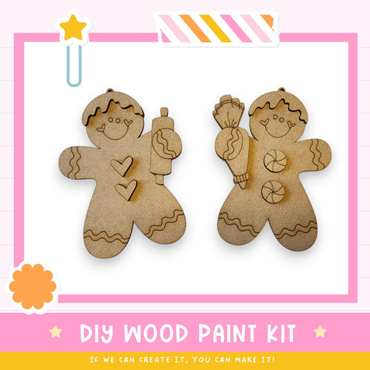 two wooden gingerbread man ornaments, each holding a different object, such as a pipe and a cake, against a pink background.