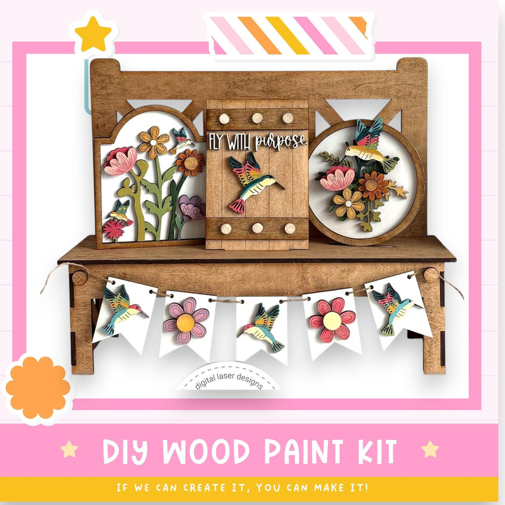 The image is a colorful and vibrant DIY wood paint kit, featuring a wooden bench with various decorative elements such as flowers and birds. The kit appears to be a creative and fun project for those interested in woodworking and painting.