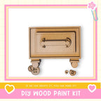 a DIY wood paint kit, with a wooden box and some wooden pieces on a white background.