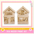 two wooden houses, each with unique designs and decorations, presented as a DIY wood paint kit.