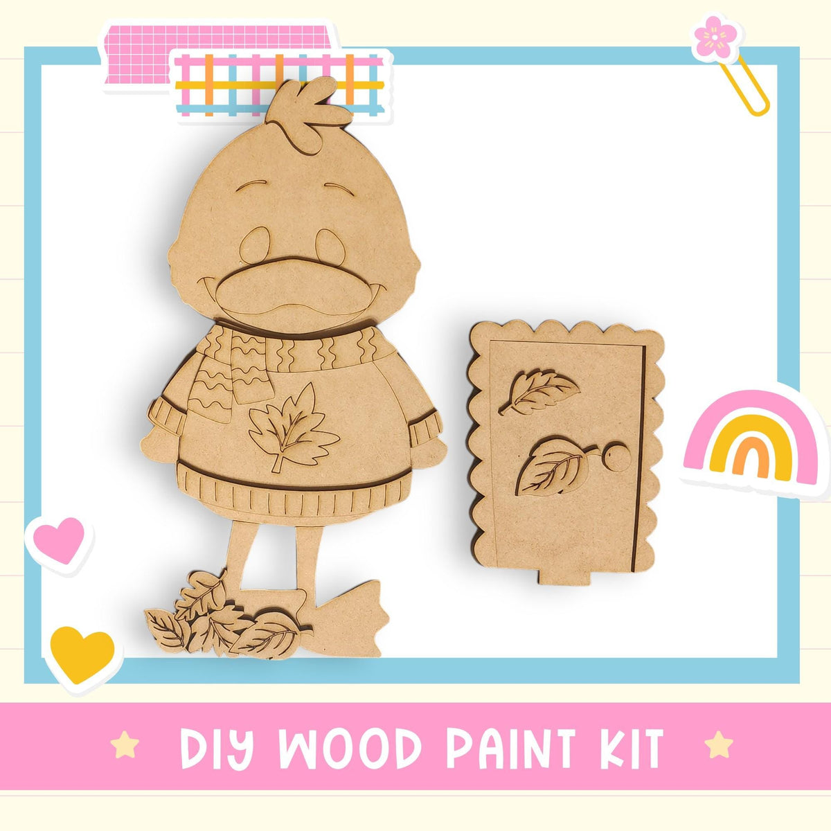 a DIY wood paint kit, including a wooden bird figure and a wooden leaf-shaped cutout, set against a background with a pink and blue border.