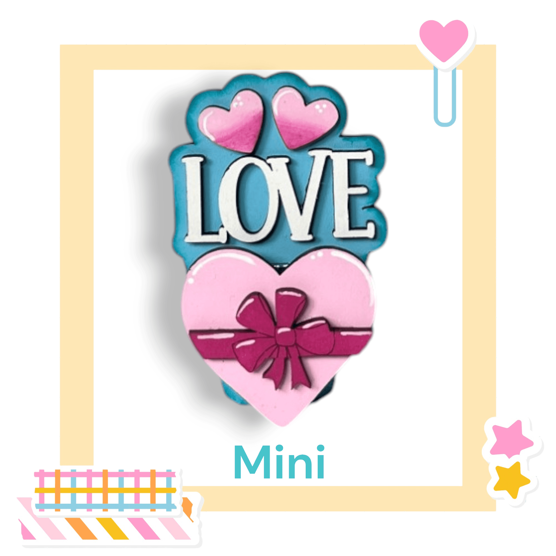 a cookie shaped like a heart with a bow