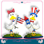 two cartoon ducks holding American flags and a firework, standing on a grassy surface.
