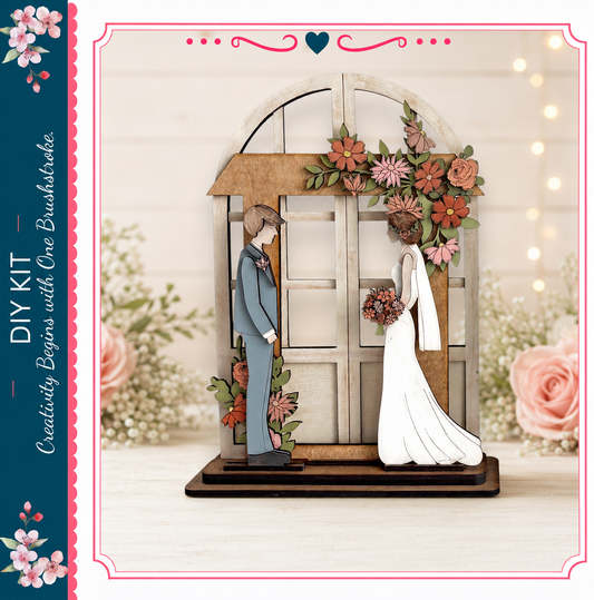 A wooden wedding arch with a bride and groom figure standing in front of it, surrounded by flowers.