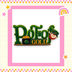 a pin with a lepreite and pot of gold on it