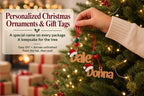 A hand holding a pair of wooden ornaments with the names "Dale" and "Donna" on them, hanging from a Christmas tree.