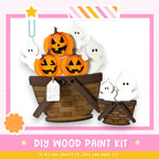The image is a DIY wood paint kit featuring a basket filled with carved pumpkins and ghostly figures, along with a tag that reads "Just for the kids".
